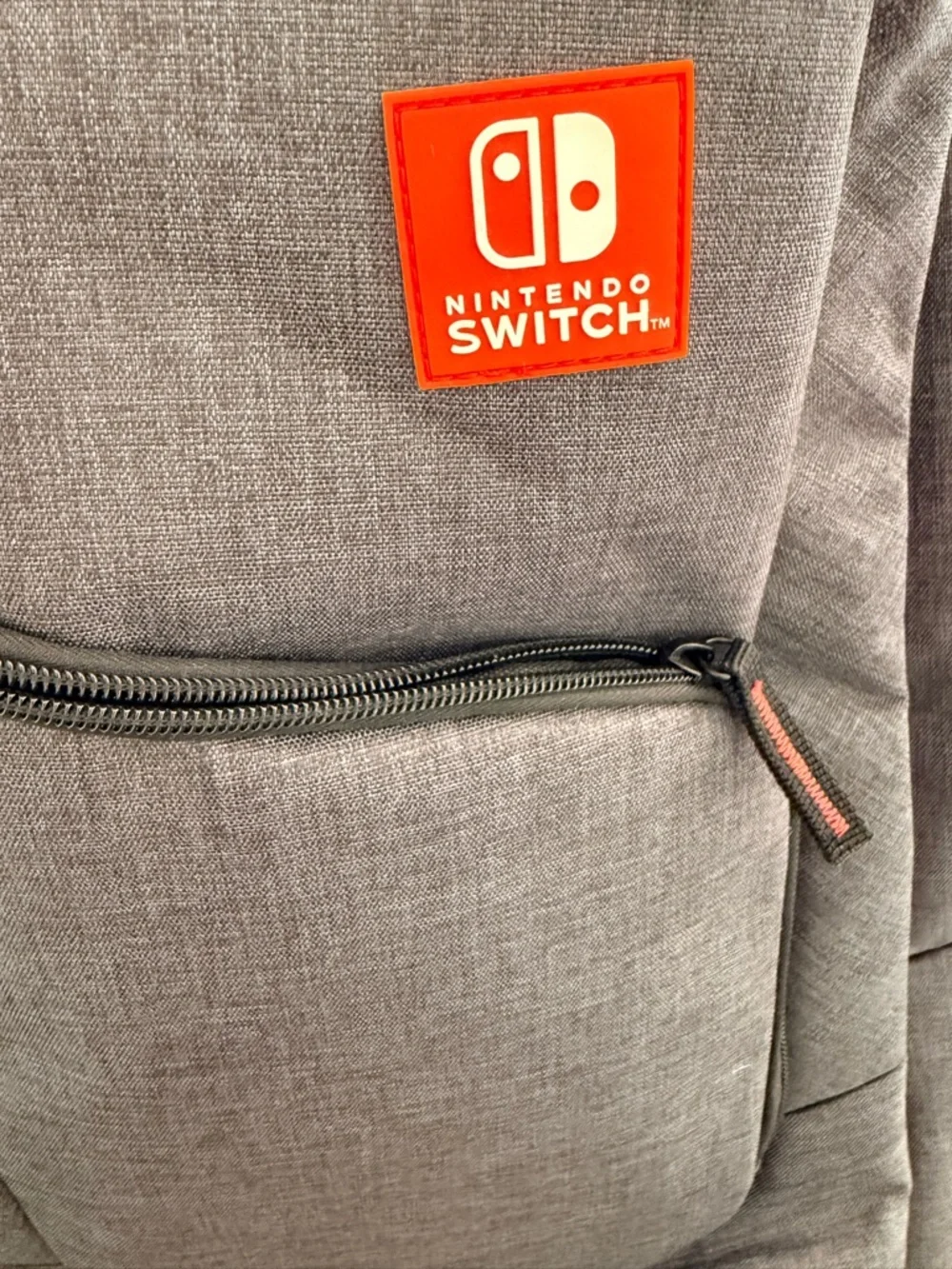 Nintendo Switch Gray Travel Backpack with Red Logo Accent